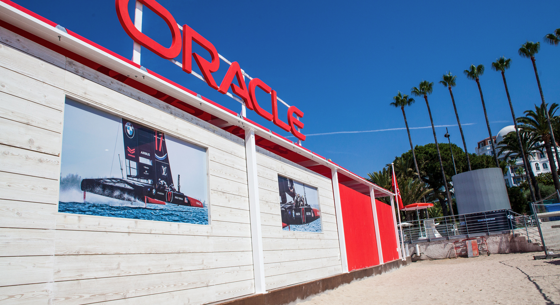 A red and white building with the word oracle on it