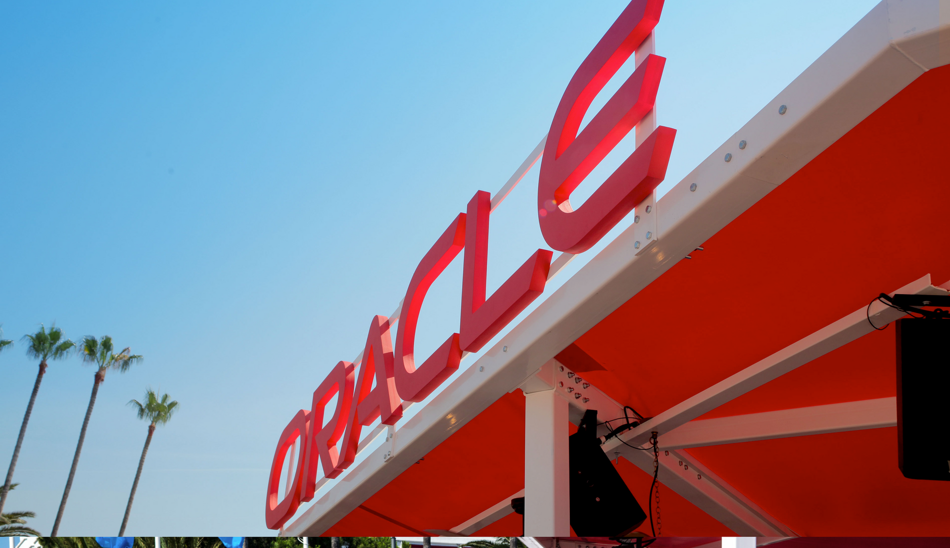 A large red sign that says oracle on it