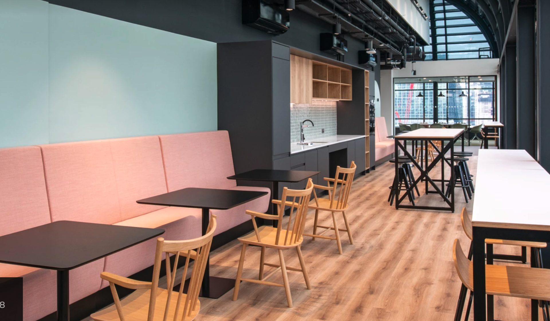 There are many tables and chairs in this room.