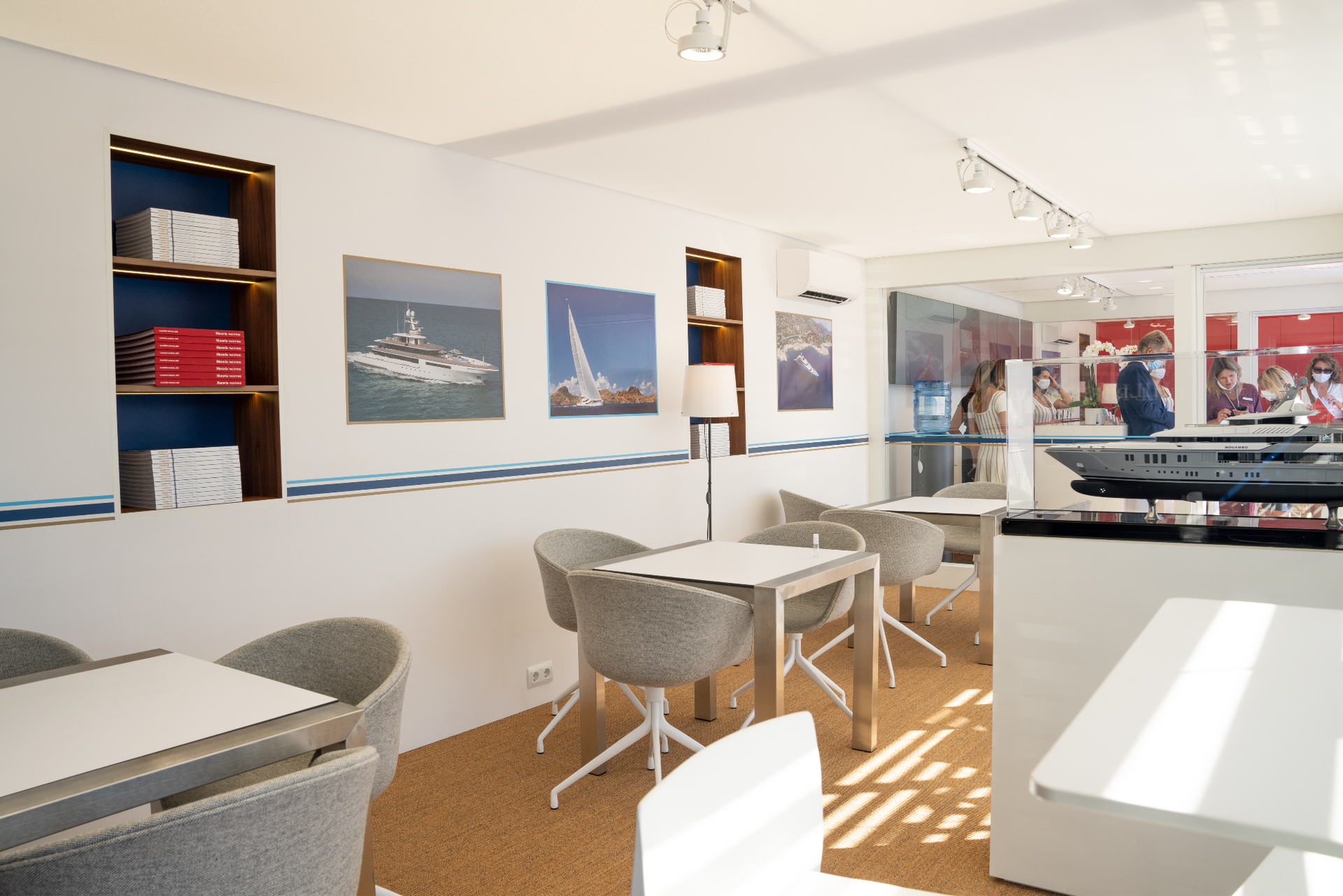 A room with tables and chairs and pictures on the wall