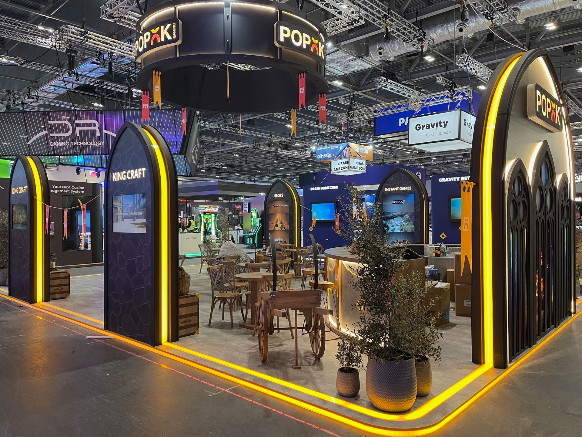 A large indoor display with a lot of tables and chairs.
