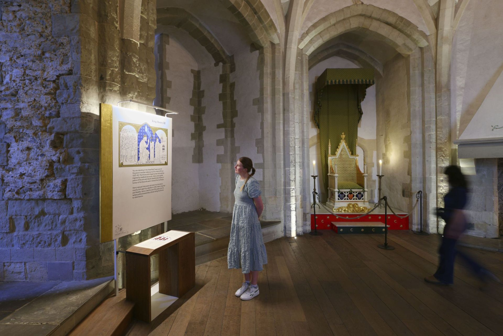 A table with clothes and bags on it in a store.