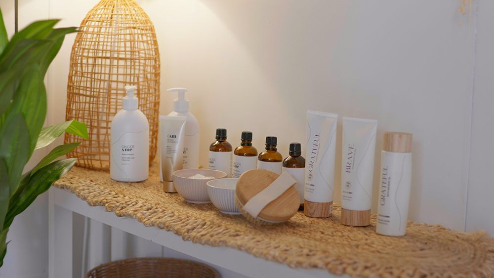 A Shelf Filled with Bottles and Bowls of Beauty Products — Figtree Day Spa in Sawtell, NSW