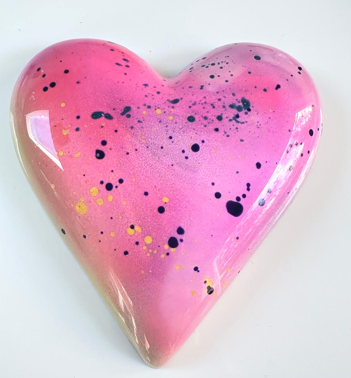 Zingy passion fruit Truffles, encased in white chocolate and dusted with raspberry sugar. 
