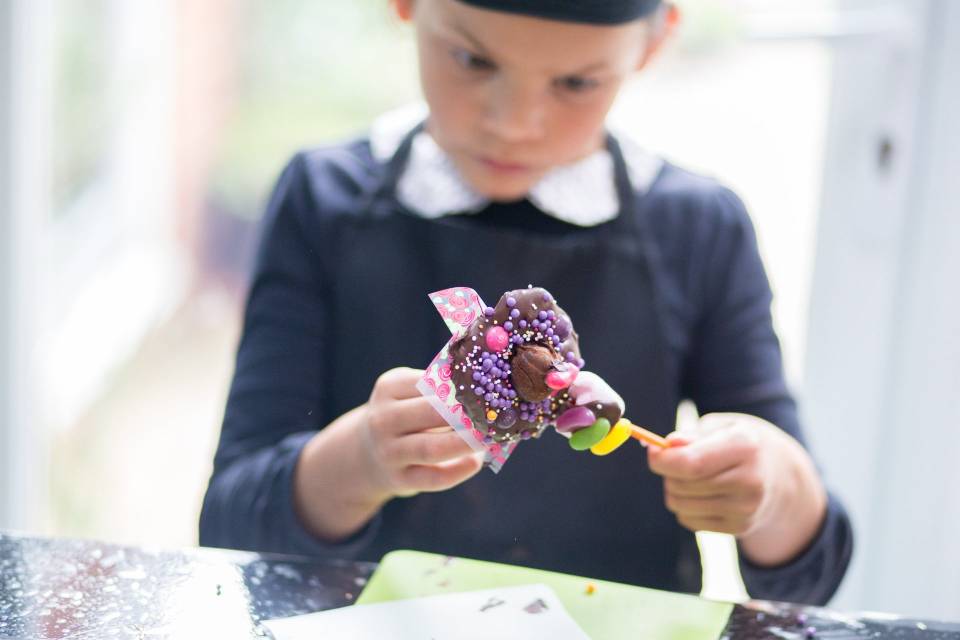 boy unwrapping a chocolate