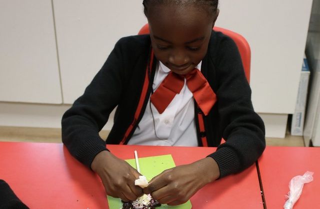 black boy making chocolate