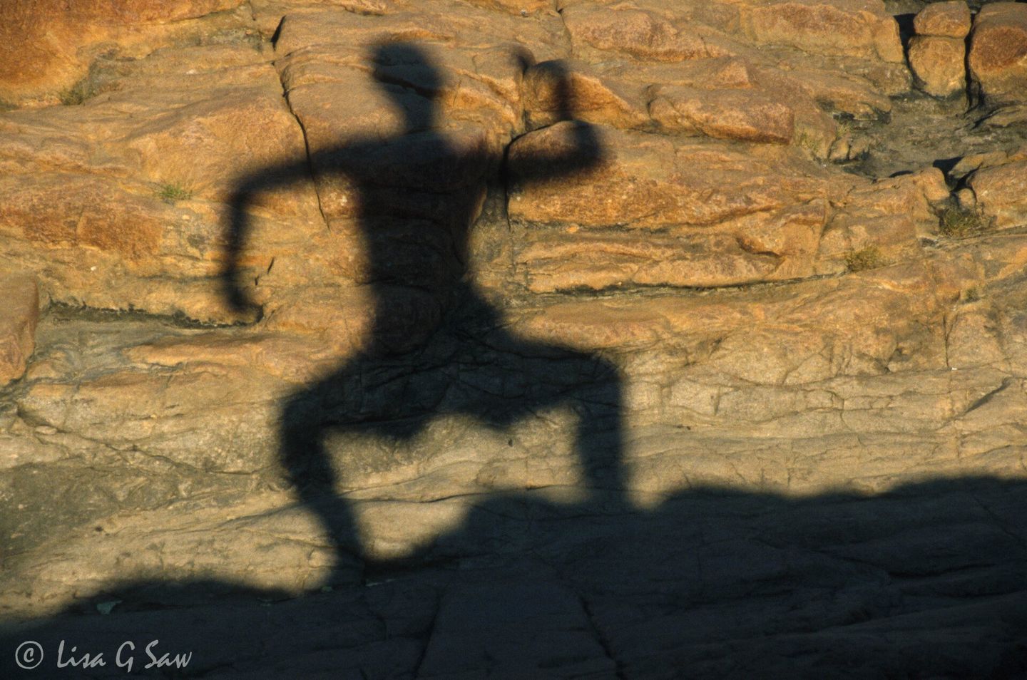 Lisa's shadow in a warrior pose in Northern Territories, Australia