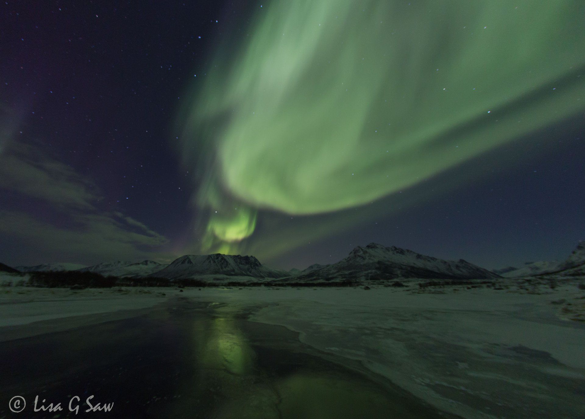 Northern Lights erupting from mountain, Norway