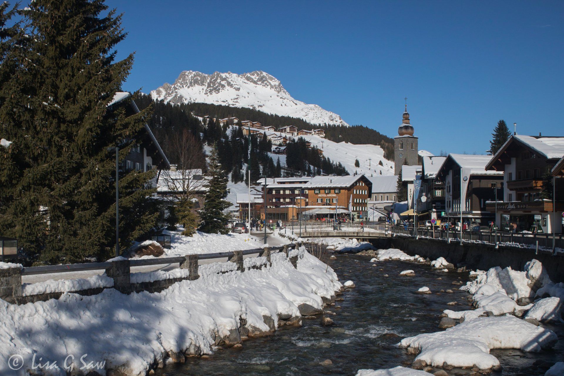 River running through Lech with church in background
