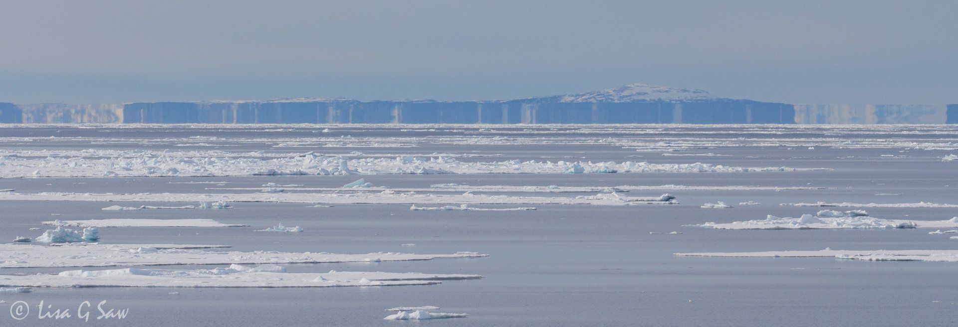 Mirage on horizon beyond Arctic sea ice looking like bar code