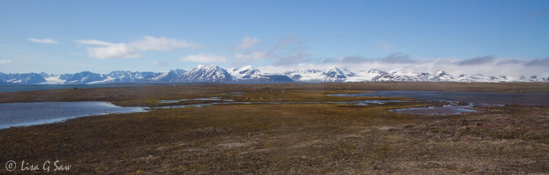 Northwest Spitsbergen National Park mountains beyond flat tundra