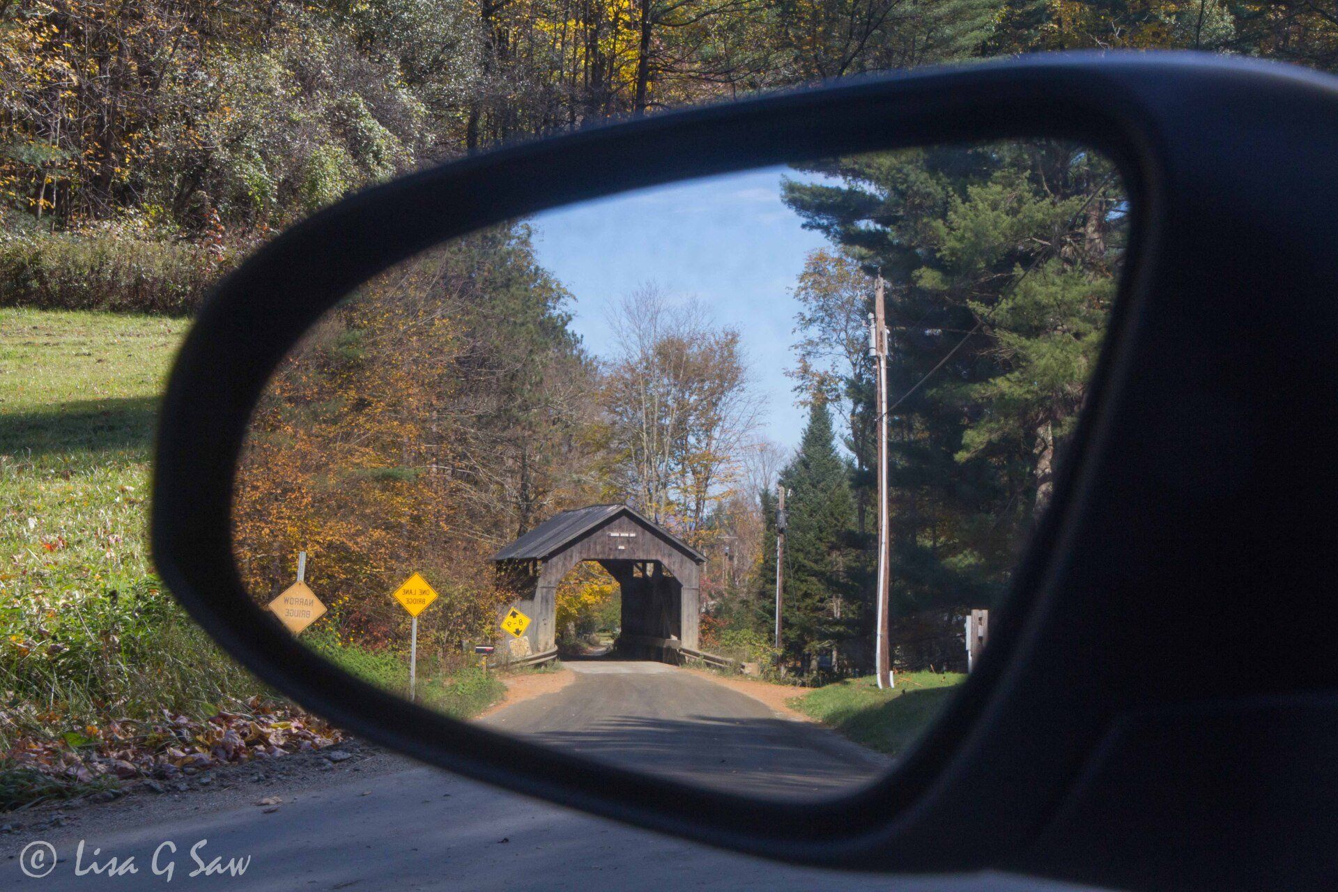 Pine Brook covered bridge in car wing mirror