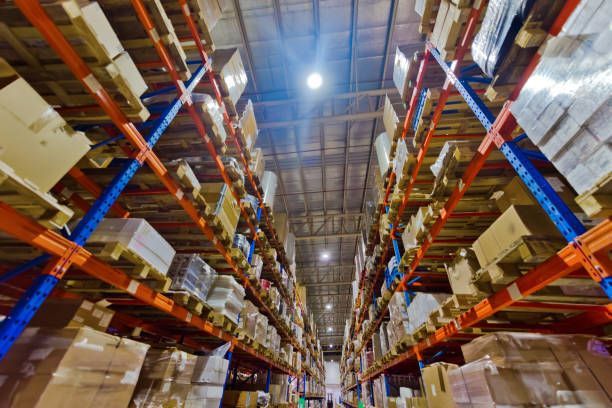 A large warehouse filled with lots of boxes and shelves.