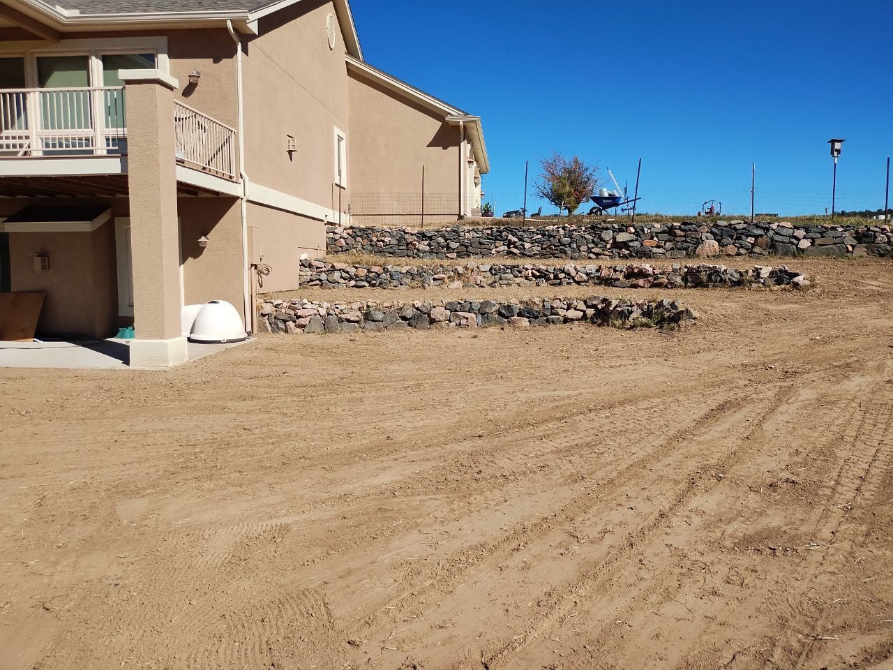 A house with a lot of dirt in front of it