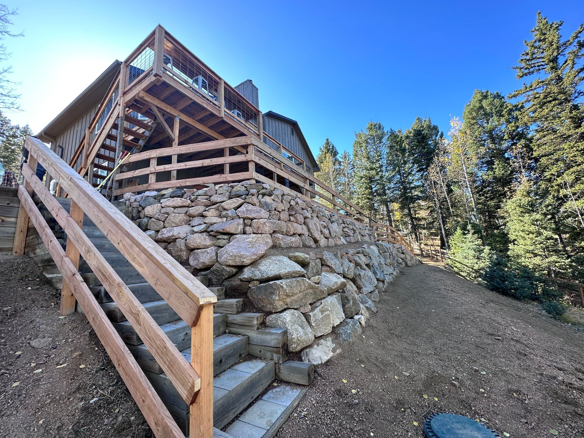 Stairs leading up to a house with a wooden railing