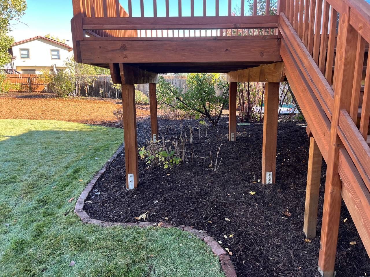 A wooden deck with stairs leading up to it