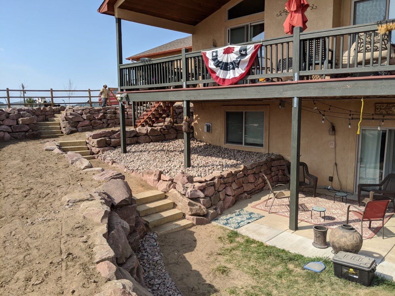 A large house with a flag on the balcony
