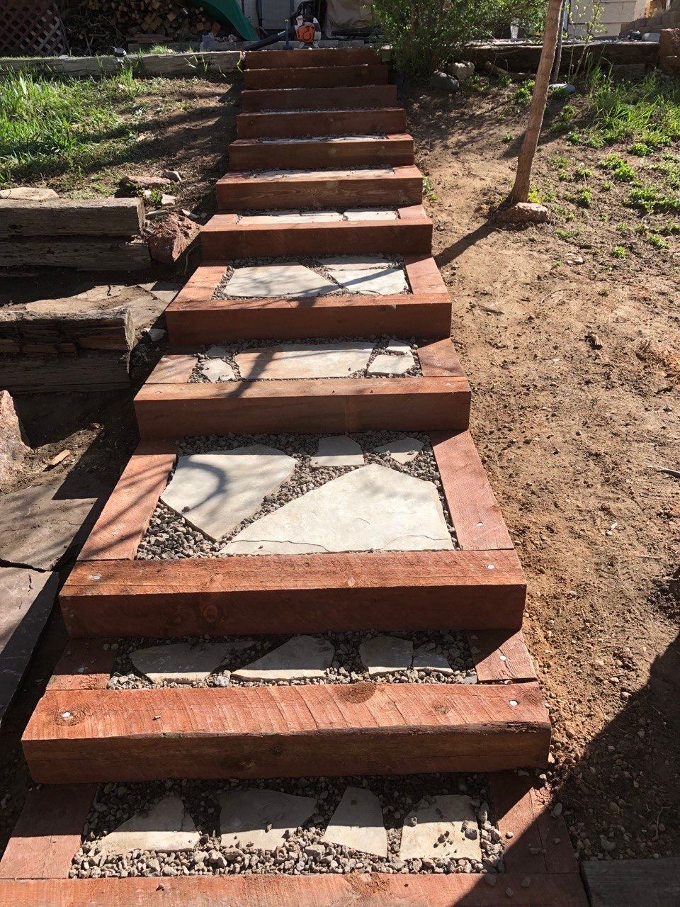 A set of stairs made of bricks and gravel