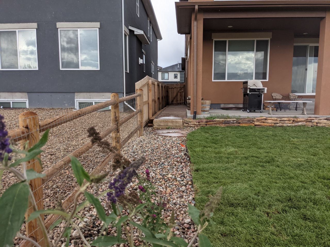 A house with a wooden fence in front of it