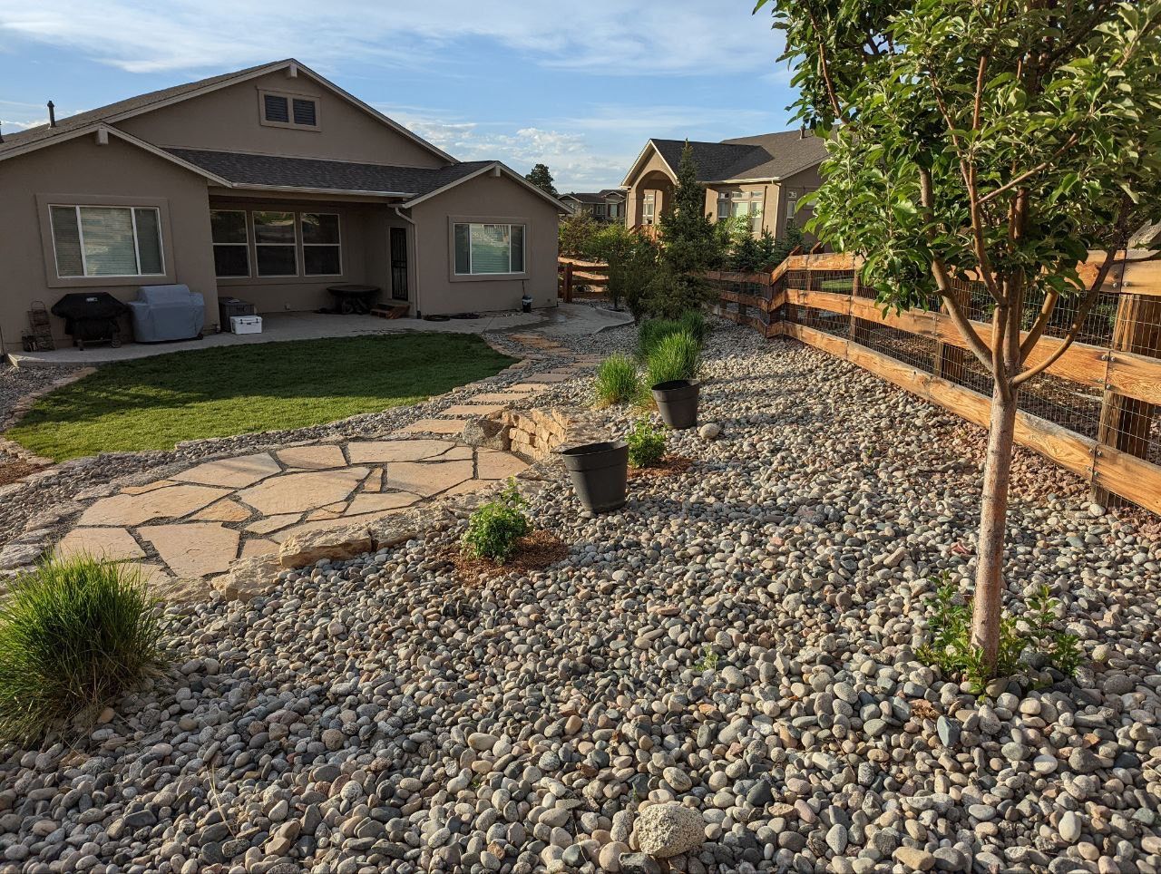 A house with a lot of rocks in front of it
