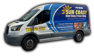 A blue and white van that says sun coast on the side