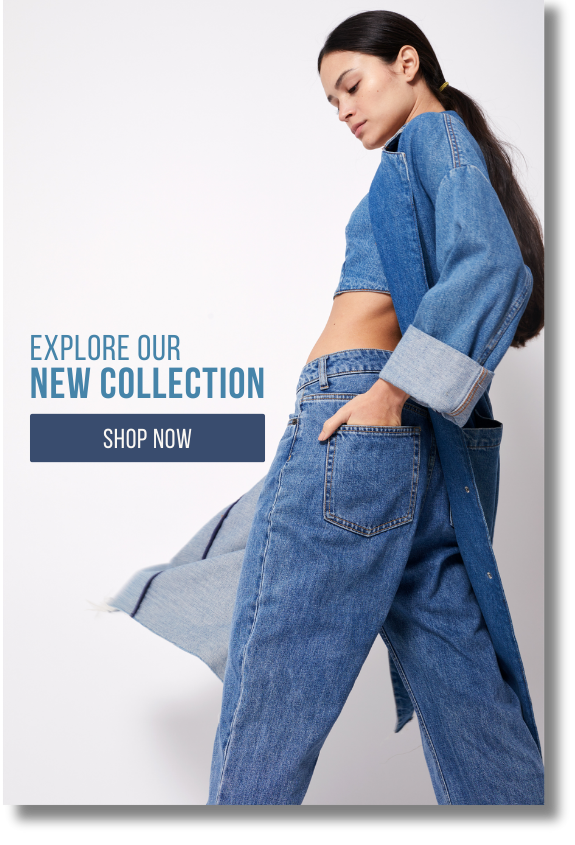 A woman is wearing a denim jacket and jeans.