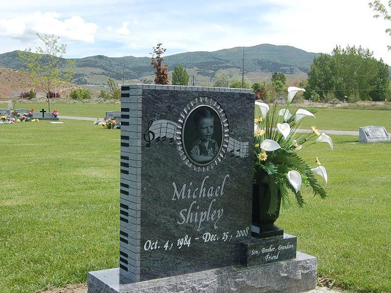 A gravestone for a child named michael shipley in a cemetery