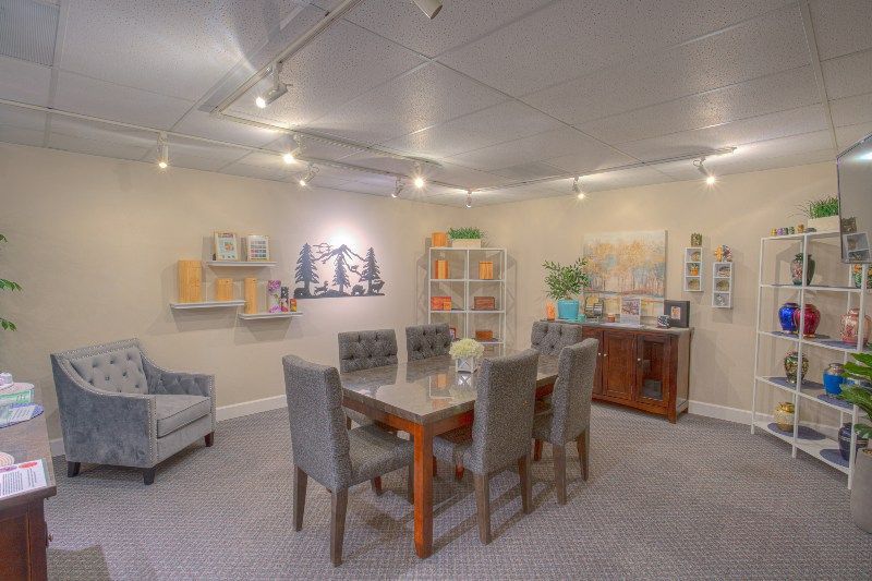 A dining room with a table and chairs in it.