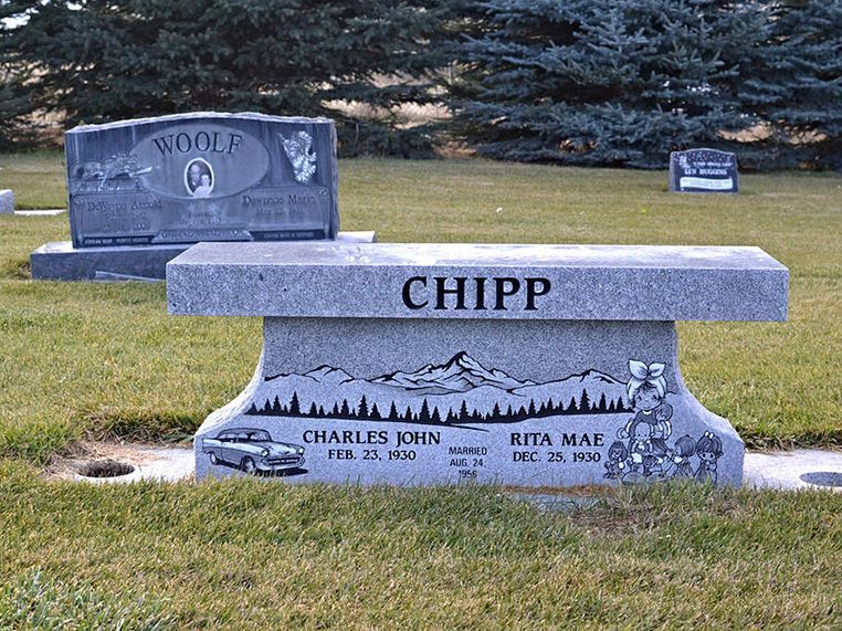 A bench in a cemetery with the name chipp on it