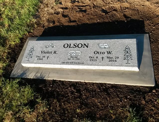 A gravestone with the name olson on it