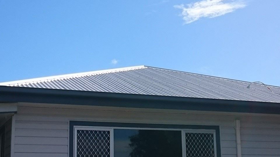 A House with A Corrugated Metal Roof — Kaplan Roofing in Walkervale, QLD