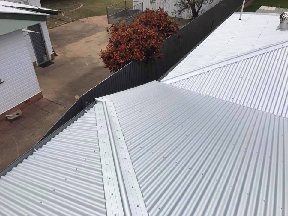 A Metal Roof with Corrugated Panels — Kaplan Roofing in Walkervale, QLD