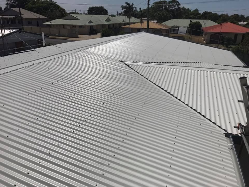 A Corrugated Metal Roof on A House — Kaplan Roofing in Walkervale, QLD