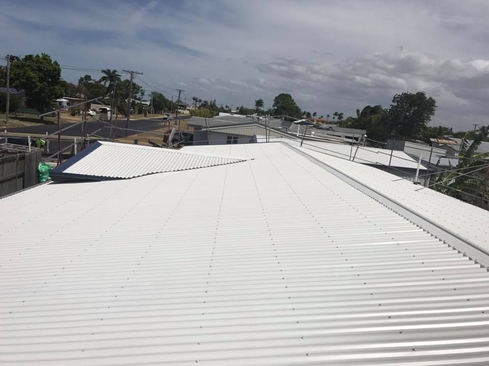 A Corrugated Metal Roofs on Buildings — Kaplan Roofing in Walkervale, QLD