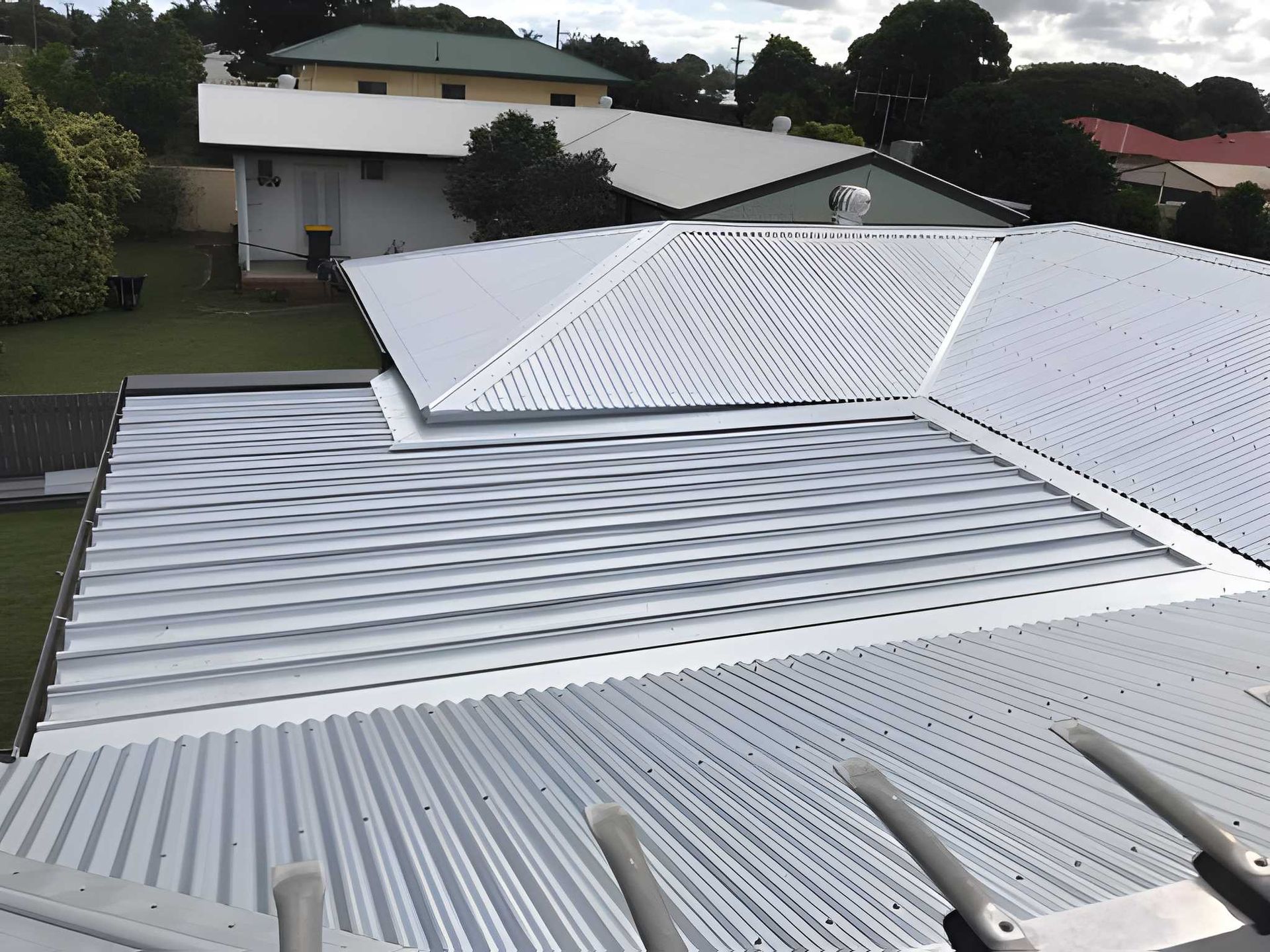 A Metal Roofs of Houses — Kaplan Roofing in Walkervale, QLD