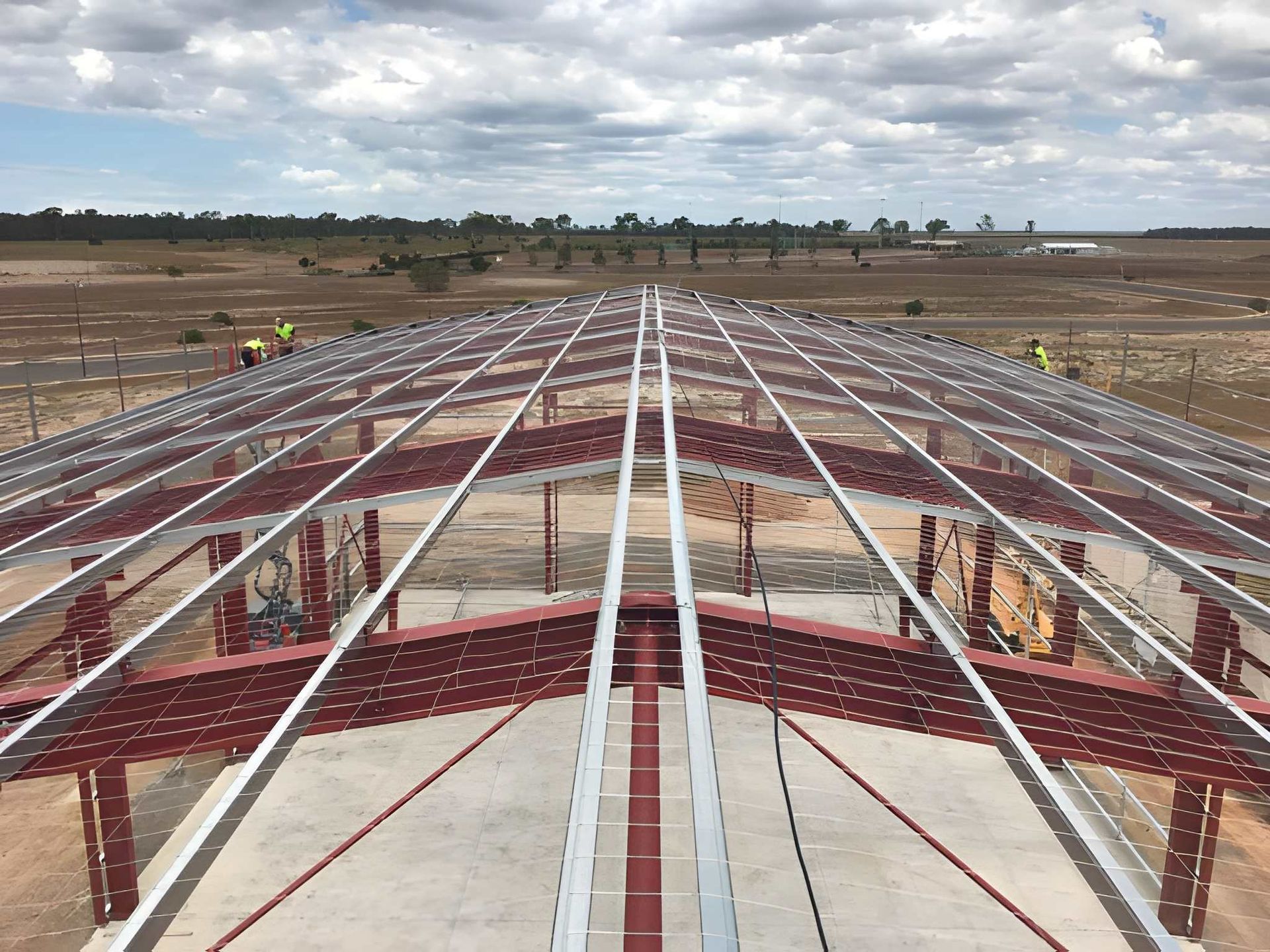 A Steel Frame of A Building Under Construction — Kaplan Roofing in Walkervale, QLD