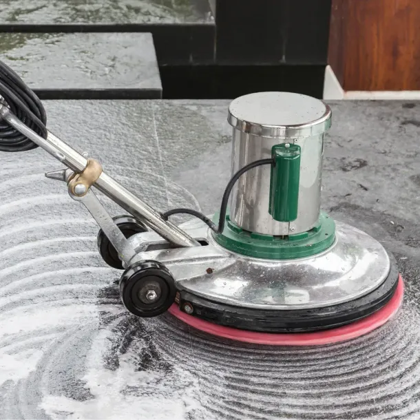 A machine is being used to clean a marble floor.