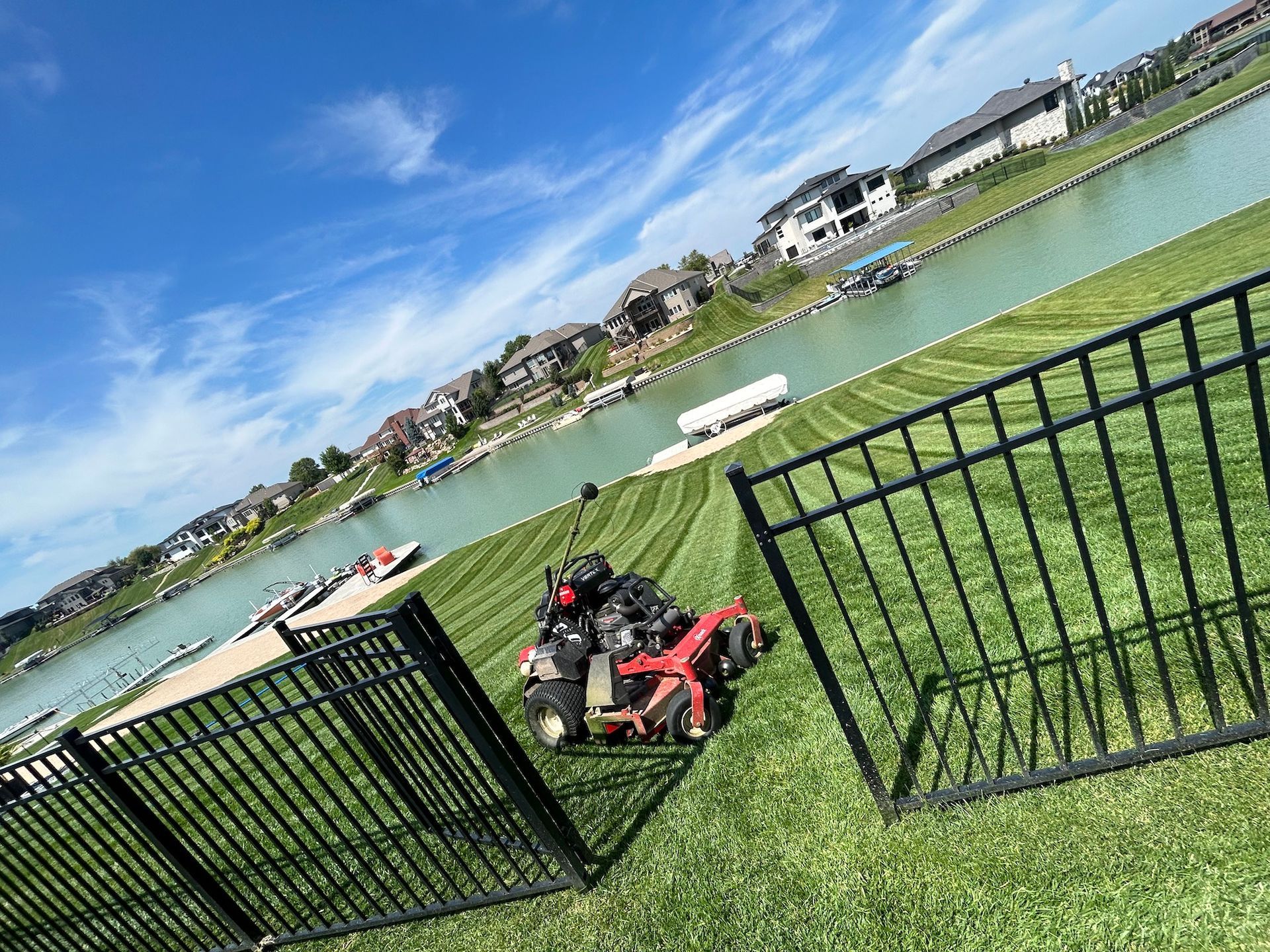 Lawn Mowing Service on residential property on lake.