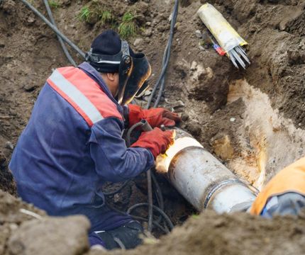 plumber performing sewer line repair
