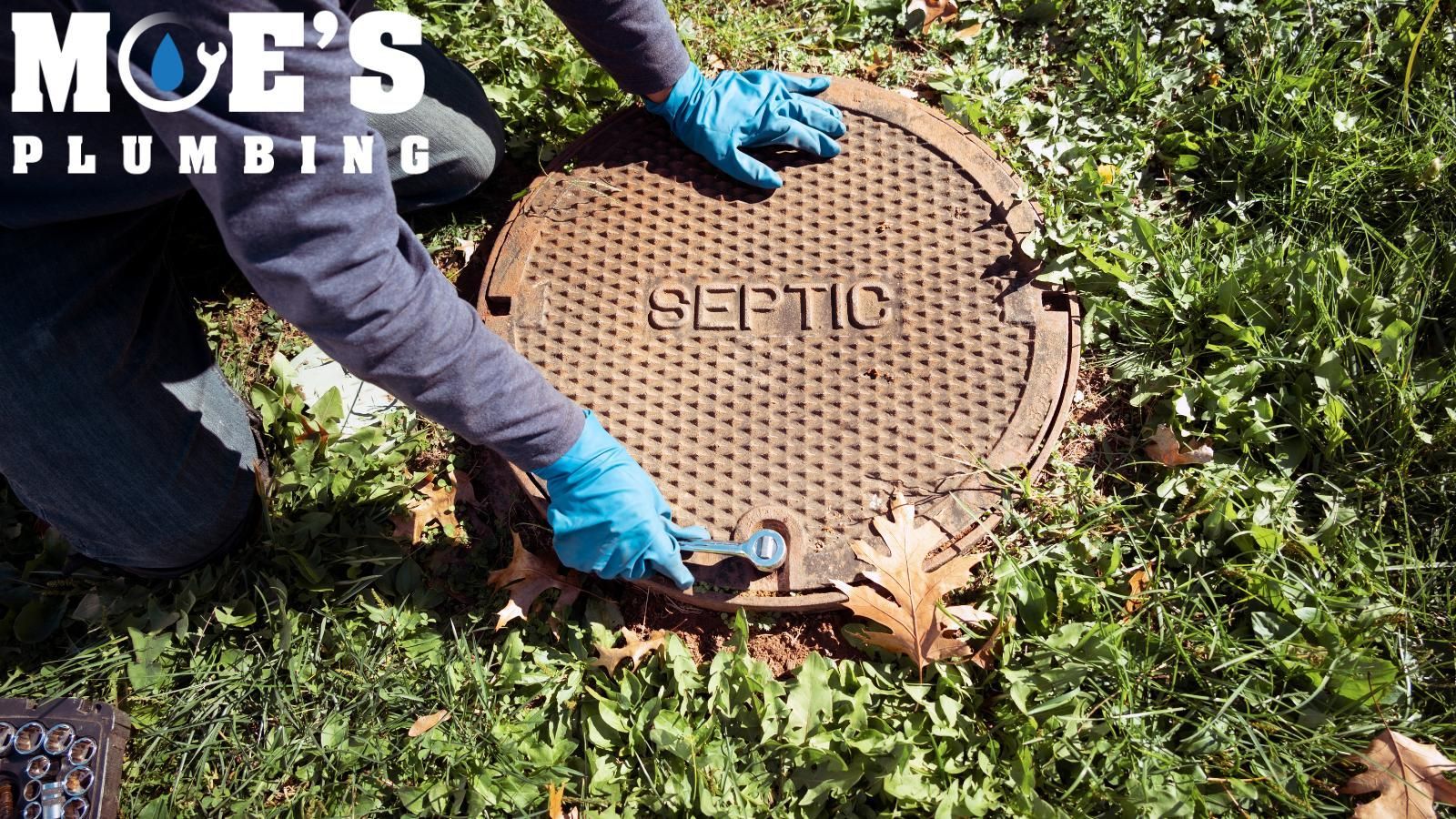 Sewer line technician opening up septic system.