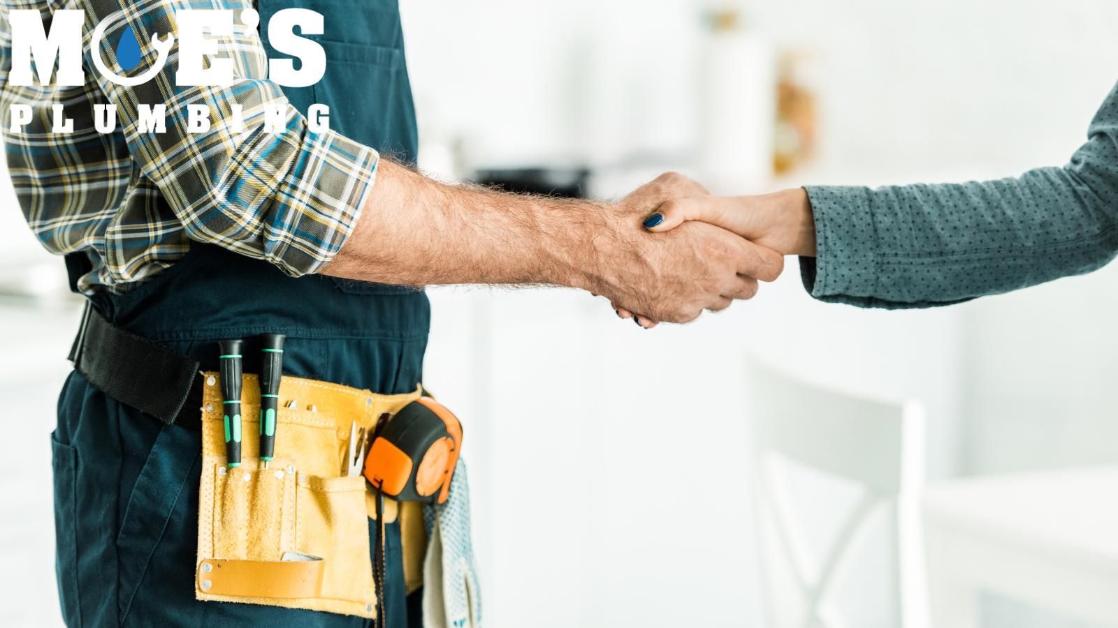 sewer cleaning tech shaking hands with client