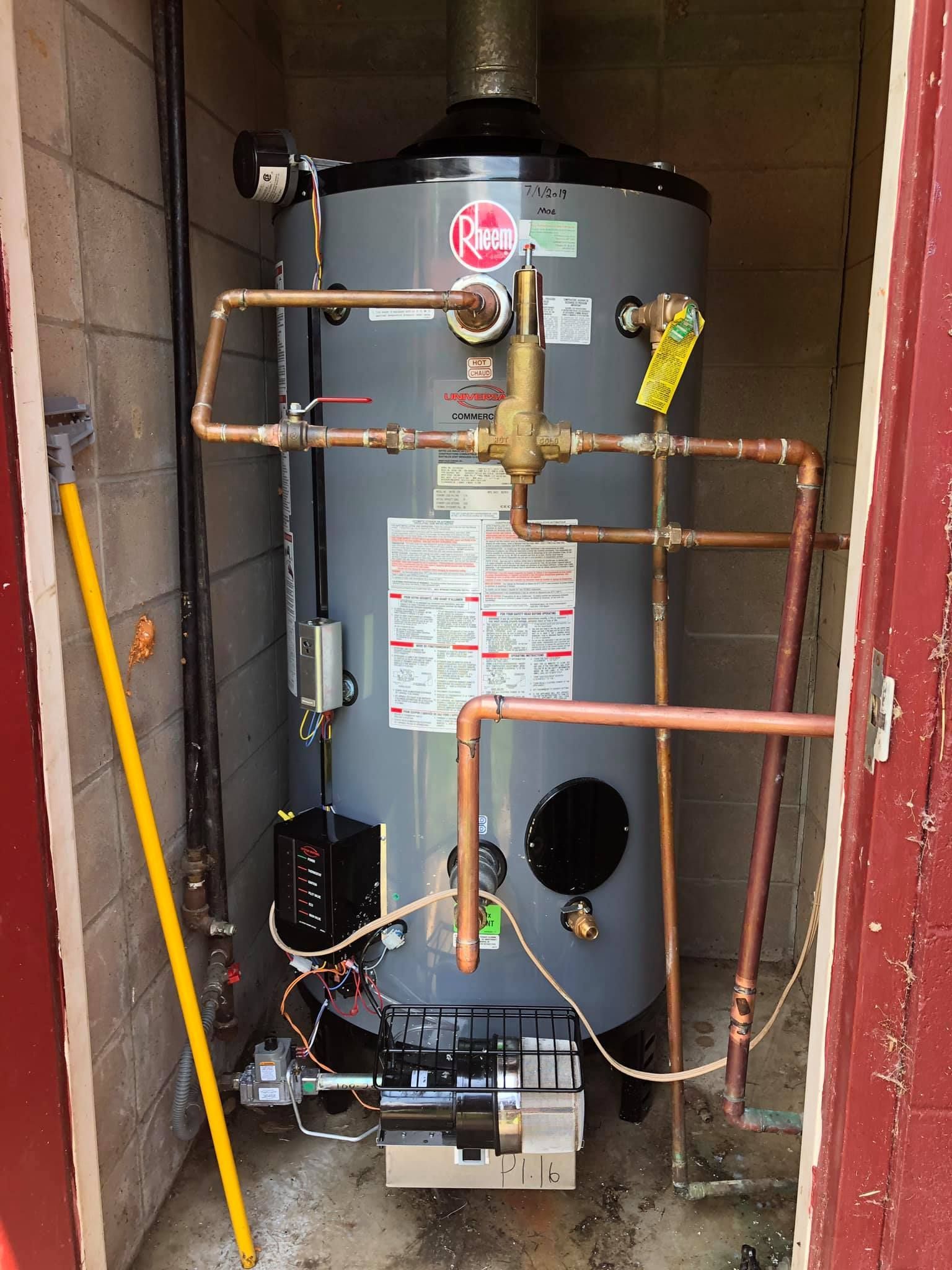 Gas water heater with copper piping and venting in a narrow utility closet