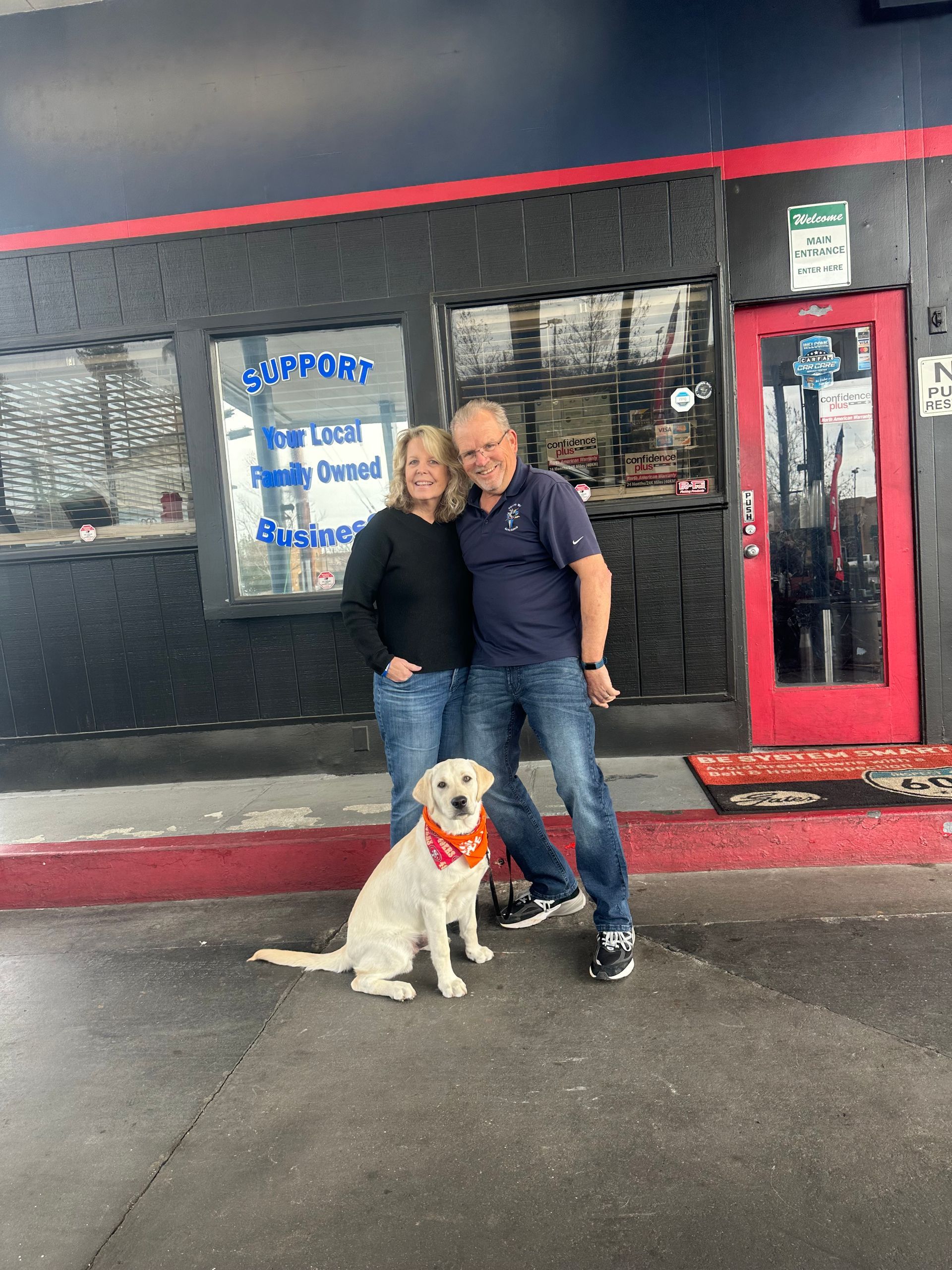 Staff Members With Dog at Solano Way Auto Repair