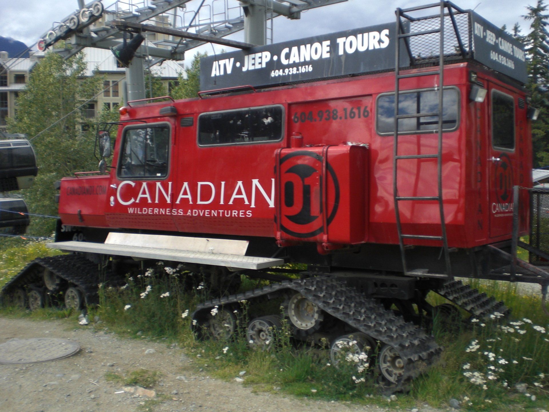 Red snow groomer with 