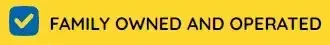 A yellow sign that says family owned and operated