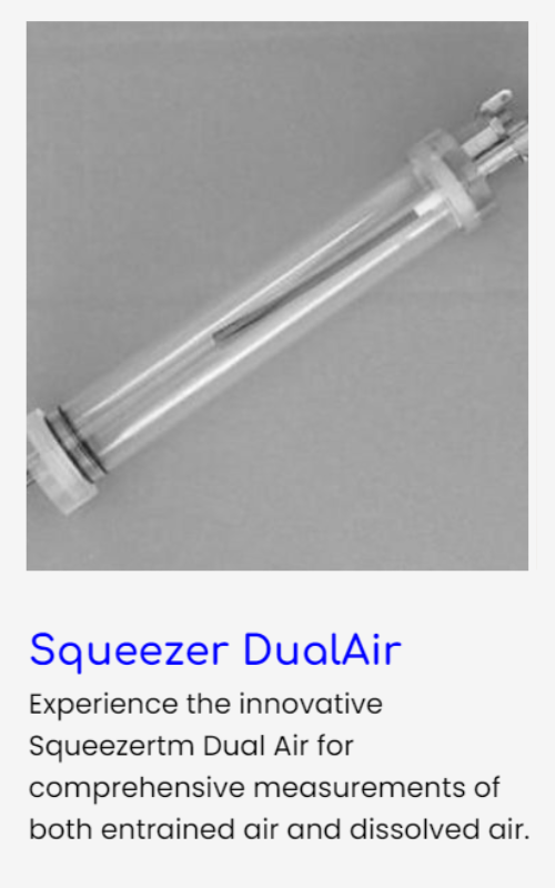 A black and white photo of a syringe with a t on it