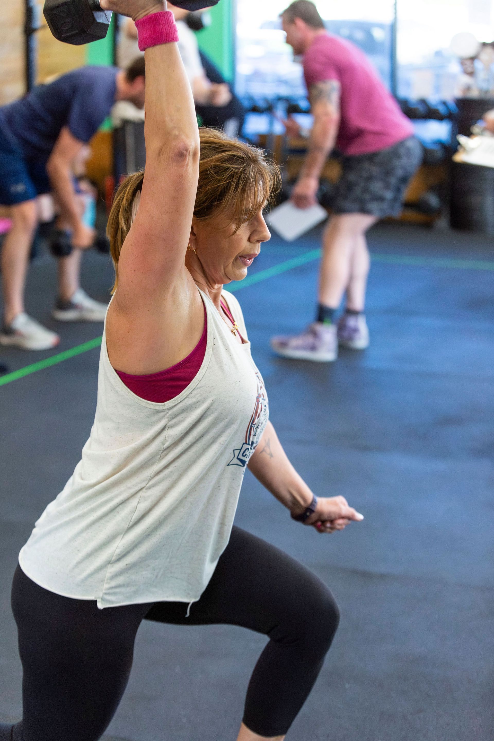 A woman is jumping over a box  at CrossFit Montrose near Glendale, CA