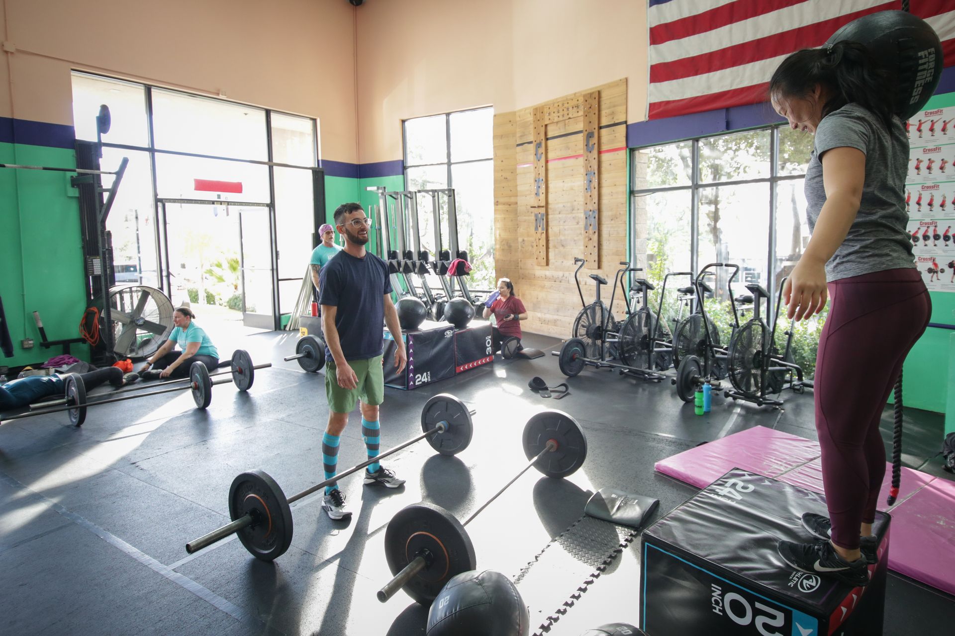 A group of people are working out in a gym.