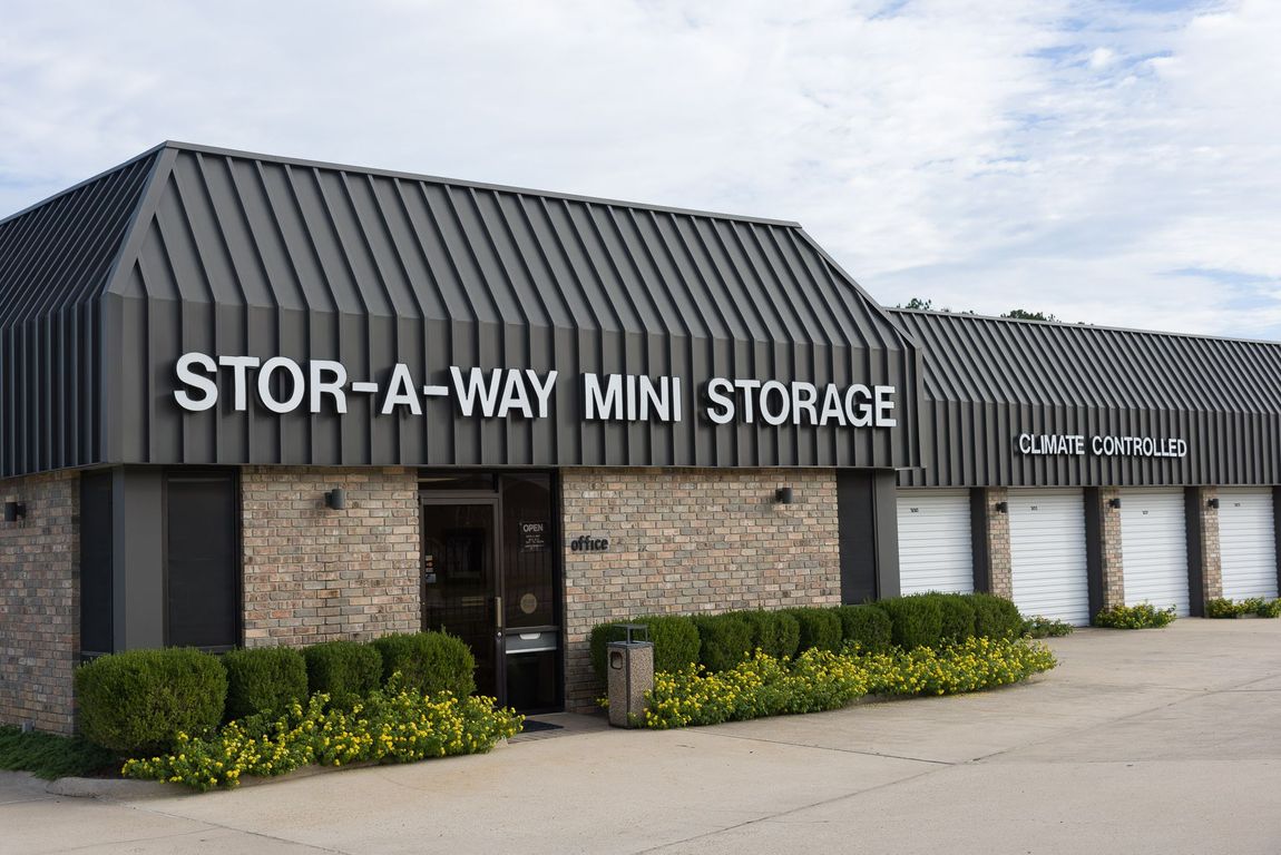 A building with a sign that says stor-a-way mini storage