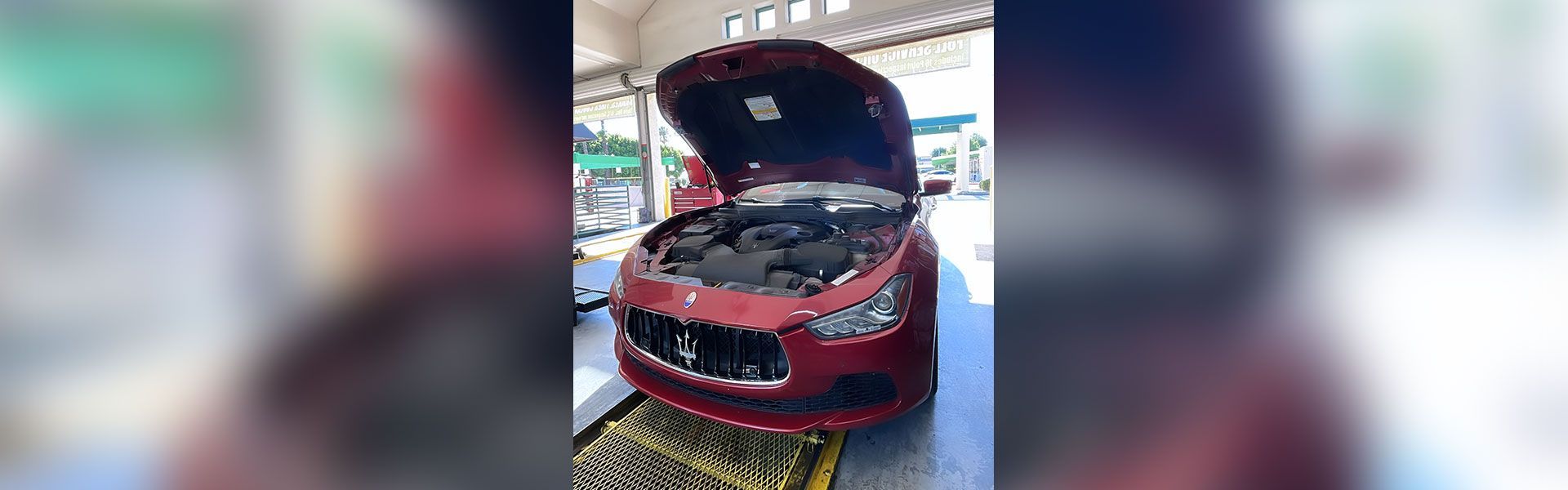 Car engine in mechanic bay | Rancho Express Lube